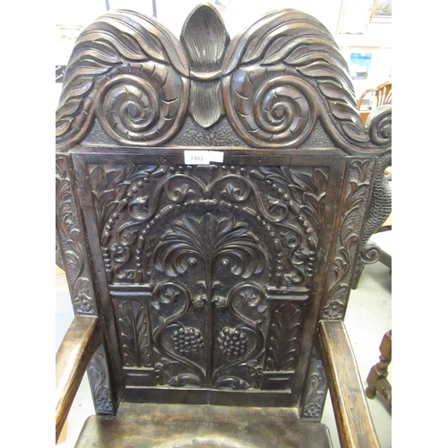 1982 - Carved walnut Wainscott chair in 17th Century style, the scroll cresting rail above a tree of life b... 