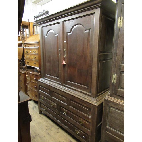 1948 - Mid 18th Century oak bacon cupboard, the moulded cornice above a pair of fielded panel doors enclosi... 