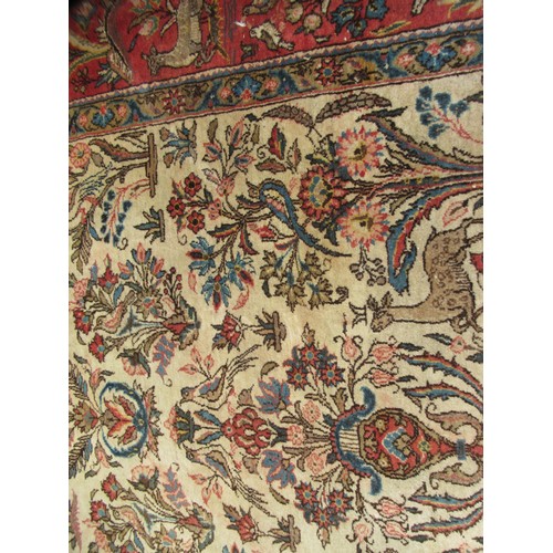 11 - Tabriz rug with an all-over vase, animal and bird design on an ivory ground with borders, 206 x 138c... 