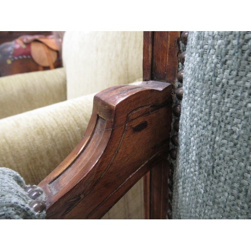 1958 - Victorian walnut upholstered sofa, the top rail pierced and leaf carved, the shaped seat on tapered ... 