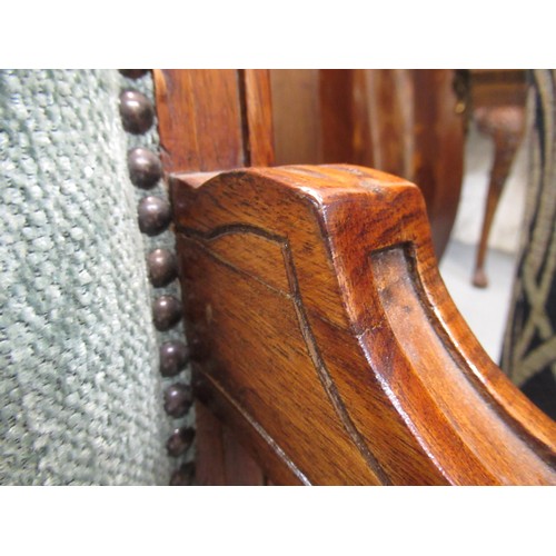 1958 - Victorian walnut upholstered sofa, the top rail pierced and leaf carved, the shaped seat on tapered ... 