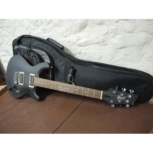 288 - Cort six string electric guitar with black black finish and soft carry case (as new)