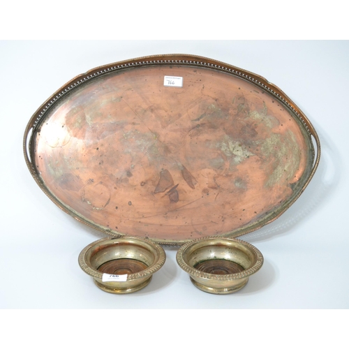 766 - Pair of 19th Century circular plated on copper wine bottle coasters, together with an oval plated ga... 