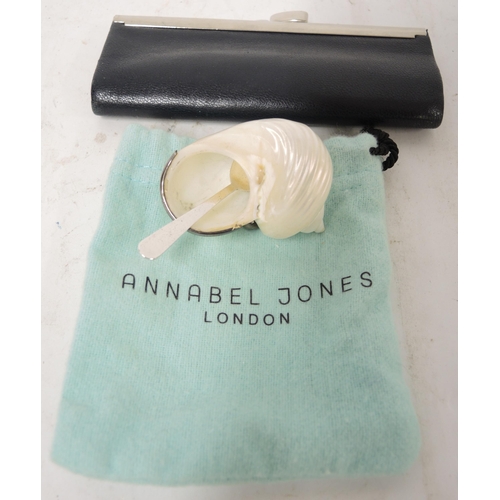 810C - Annabel Jones, London silver mounted mother of pearl shell form salt with spoon and a small leather ... 