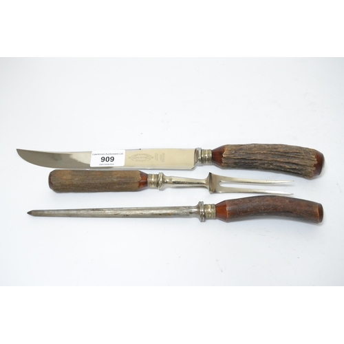 909 - Steel and stag horn handled three piece carving set