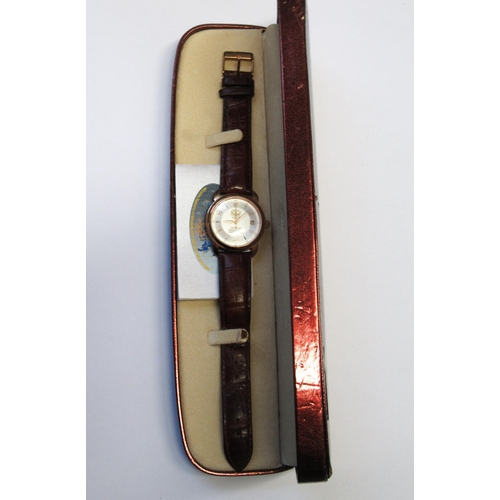 949 - Russian circular gold plated manual wind wristwatch by Cobet, with a brown leather strap, in origina... 