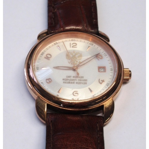 949 - Russian circular gold plated manual wind wristwatch by Cobet, with a brown leather strap, in origina... 