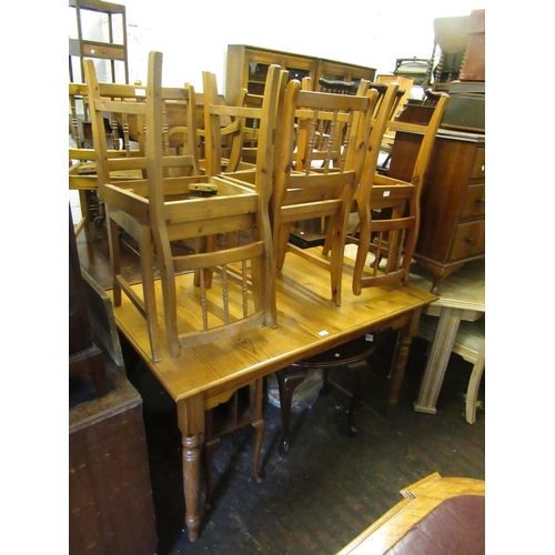 1576 - Modern pine rectangular extending dining table on turned supports, together with a set of eight (six... 