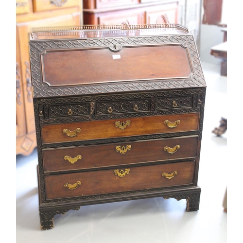 1582 - 19th Century mahogany bureau, the fall front and upper drawers with blind fretwork and conforming fi... 