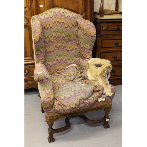 1591 - 19th Century wingback armchair, in Carolean style on shaped supports with crossover stretcher (for r... 