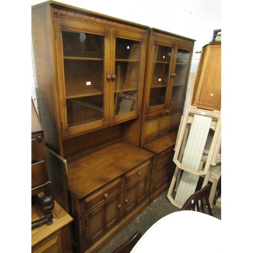 1594 - Pair of 20th Century Ercol medium elm bookcases, one with fall front bureau