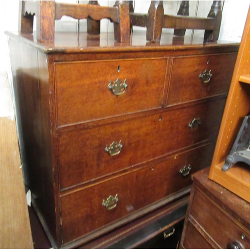 1867 - George III oak chest of two short over two long drawers with later brass swan neck handles, on low b... 