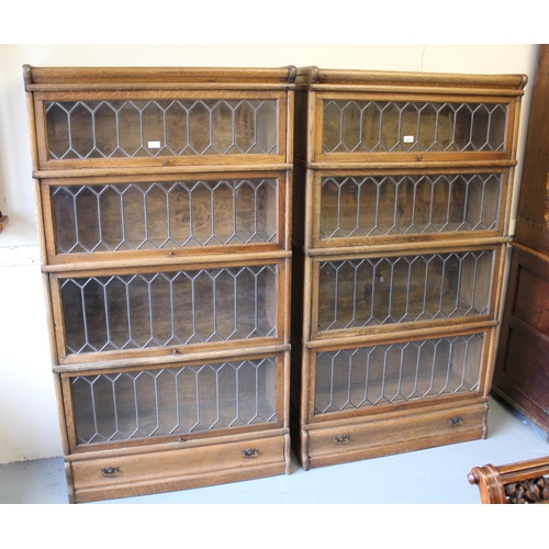 1978 - Pair of oak Globe Wernicke four section bookcases with leaded glass doors and single drawer to base ... 