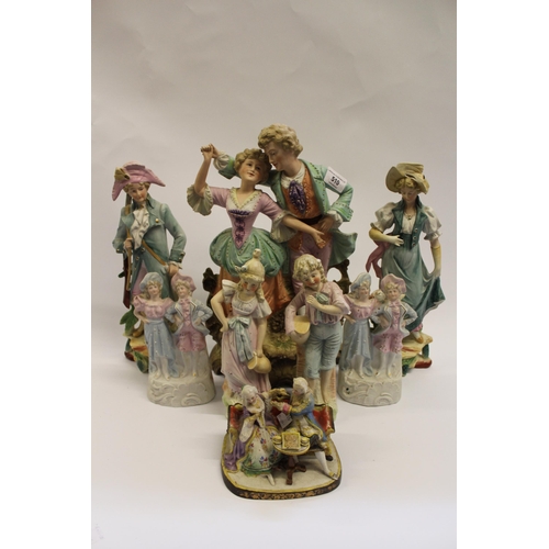 376 - Large 19th Century bisque group of a boy and girl together with other various similar, smaller bisqu... 