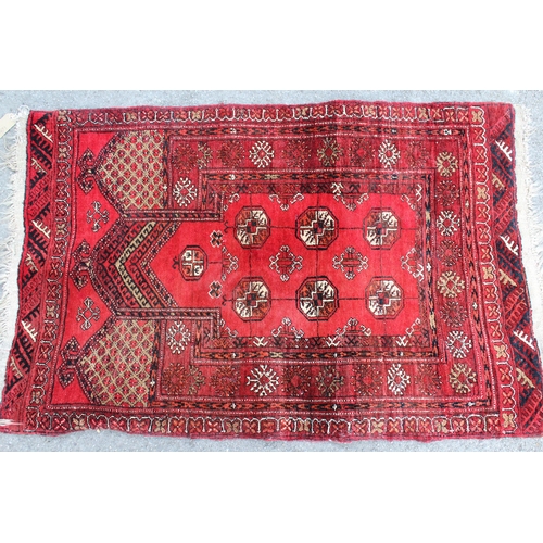 1 - Afghan prayer rug with seven gol design on a red ground with borders, 110 x 73cm approximately