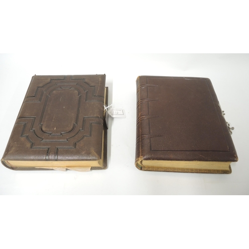 116 - Two good quality Victorian embossed leather bound photograph albums with some contents