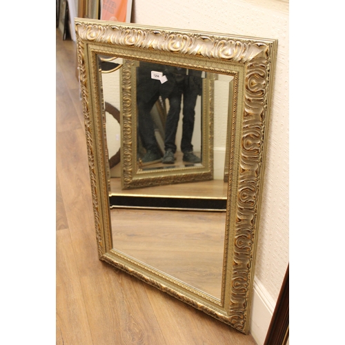 1294 - Reproduction gilt moulded bevel edged wall mirror, 95 x 70cm