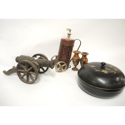 137 - Cast iron model of a cannon, novelty decanter, pair of turned wooden vases and a papier mache circul... 