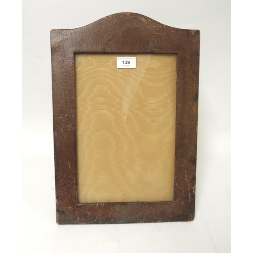 139 - Asprey, early 20th Century brown leather arched top photograph frame, 43 x 29.5cm