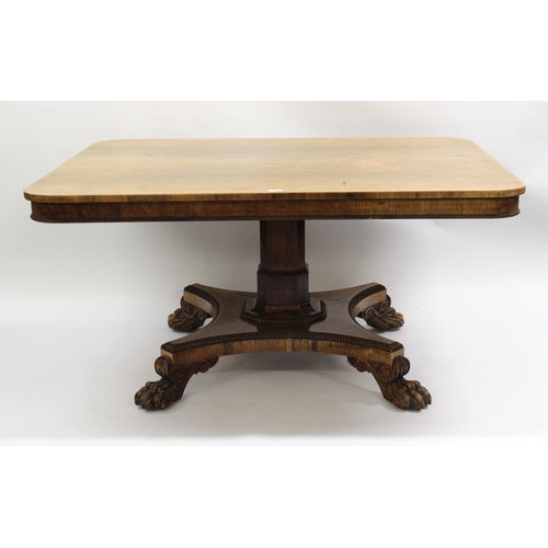 1452 - 19th Century rosewood rectangular tilt top centre table, having faceted column with platform base an... 