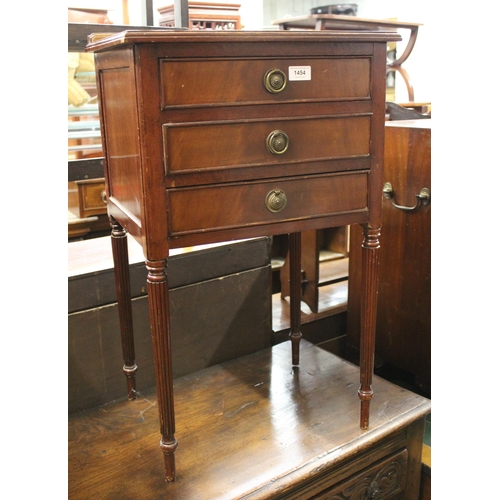 1454 - 20th Century mahogany bedside cabinet of three drawers on turned reeded supports, 46cm wide x 36cm d... 