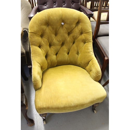 1460 - 19th Century button upholstered low seat nursing chair, on turned tapering supports with brass and c... 