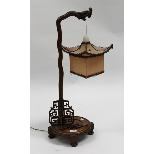 1469 - Chinese hardwood table lamp, on circular base with pagoda type shade (at fault), 73cm high