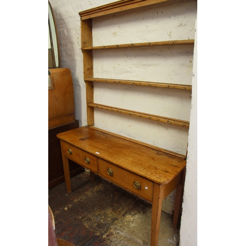 1477 - 19th Century pine dresser, having plate rack above two short drawers with later brass circular handl... 