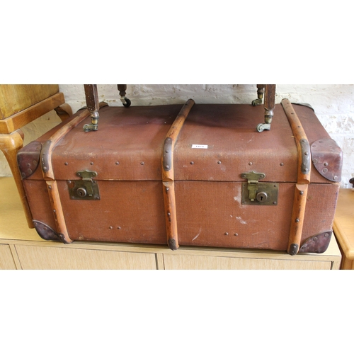 1479 - Early 20th Century canvas and wooden bound travel trunk, with the initials M.O.M.