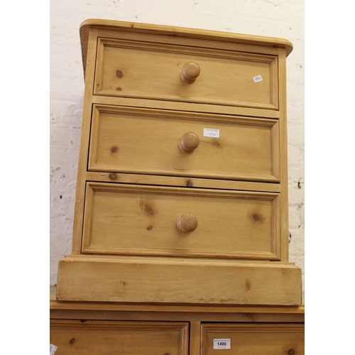 1490 - Reproduction pine chest of drawers, together with a pair of matching bedside cabinets