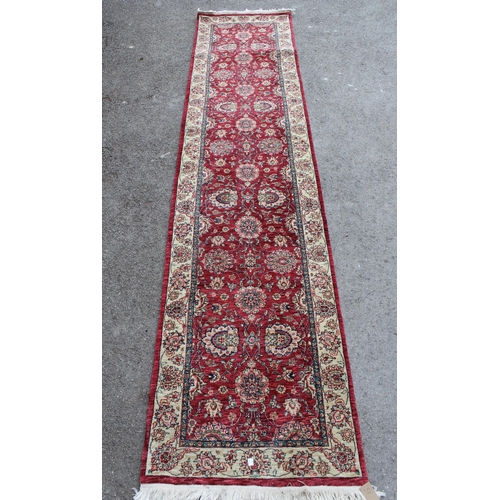 15 - Indo Persian runner of floral design with borders on a cream and red ground