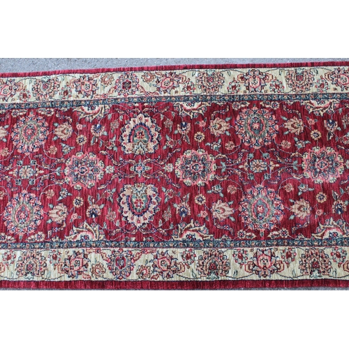 15 - Indo Persian runner of floral design with borders on a cream and red ground