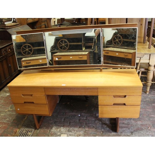 1505 - Mid 20th Century teak dressing table and stool by Uniflex, together with a matching six drawer chest... 