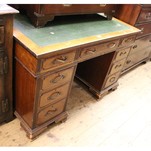 1506 - Early 20th Century mahogany twin pedestal desk with brass handles and ogee bracket feet, 122cm wide