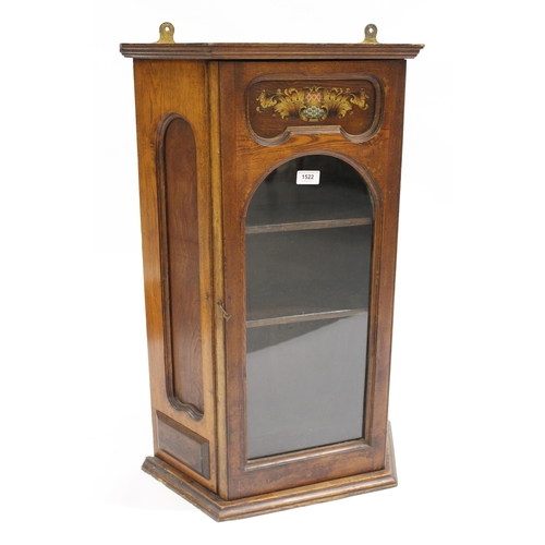 1522 - Oak hanging wall cabinet with a single glazed door and printed armorial crest, 52cm x 22cm x 78cm hi... 