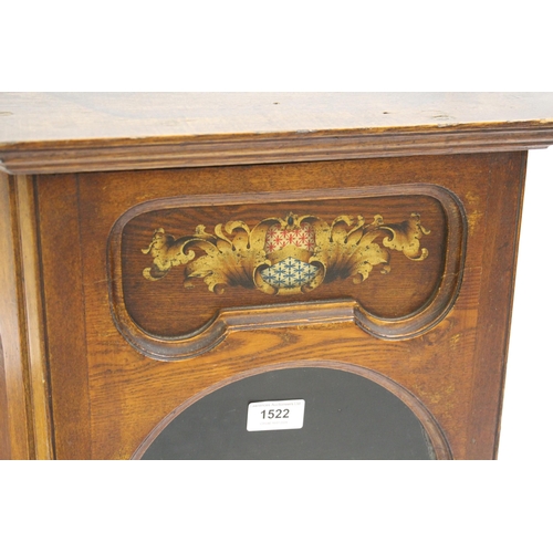 1522 - Oak hanging wall cabinet with a single glazed door and printed armorial crest, 52cm x 22cm x 78cm hi... 