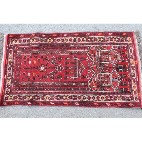 2 - Afghan prayer rug with a stylised floral design on a red ground with borders, 123 x 70cm