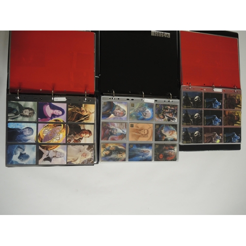 237 - Group of four albums containing Topps Lord of the Rings trading cards including some autograph cards... 