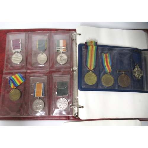 253 - Two albums of World War I and II medals