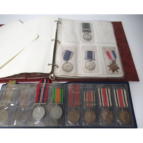 253 - Two albums of World War I and II medals