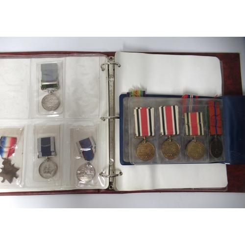 253 - Two albums of World War I and II medals