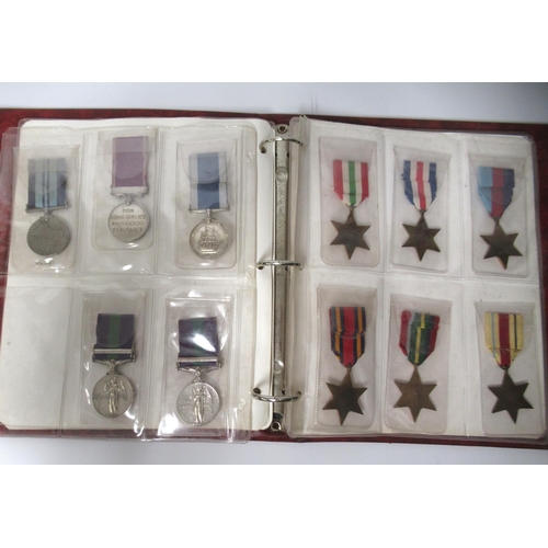 253 - Two albums of World War I and II medals