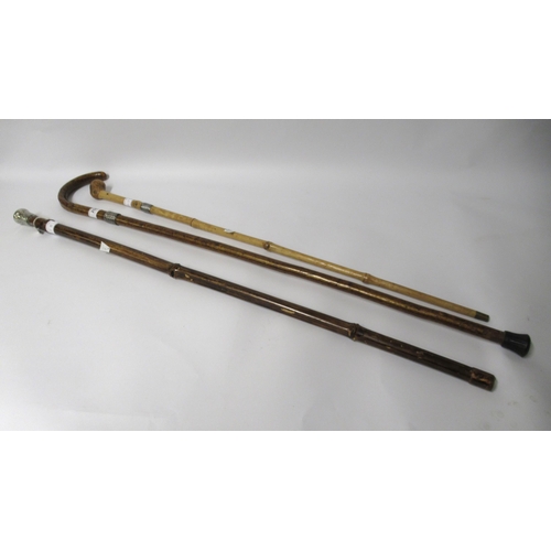 258 - Two walking canes with white metal Turks head knot mounts and another bamboo silver topped walking c... 