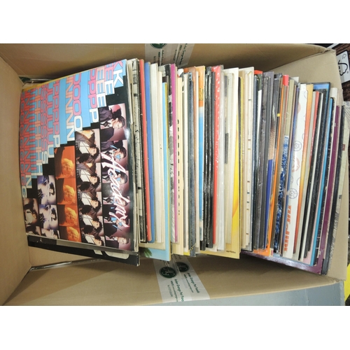 335 - Four boxes containing a large quantity of LP records, mainly 1970's and 80's, including The Beatles ... 