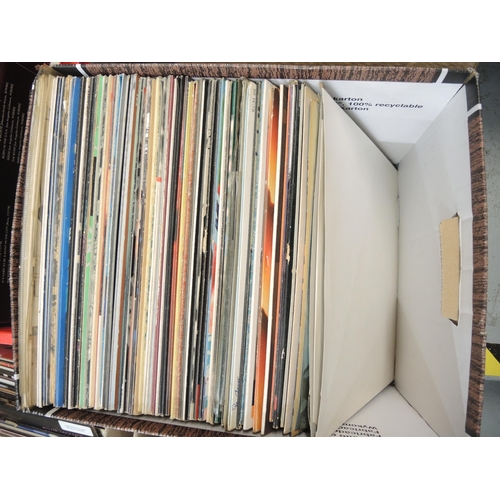 335 - Four boxes containing a large quantity of LP records, mainly 1970's and 80's, including The Beatles ... 