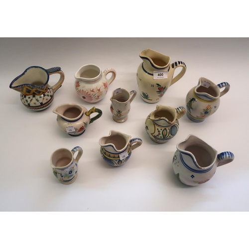 400 - Group of ten various small Quimper pottery jugs