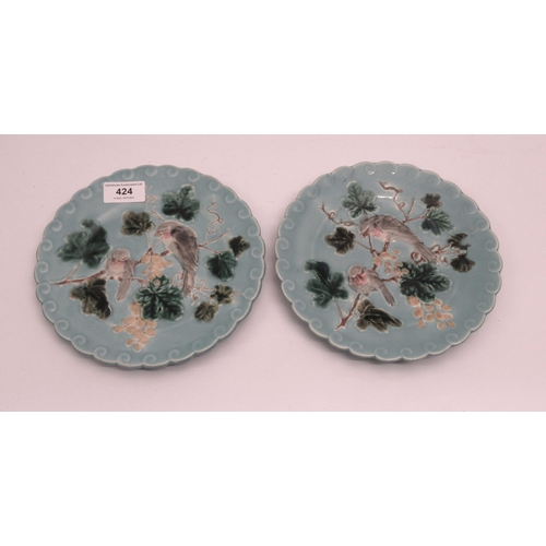 424 - Pair of Sarreguemines plates decorated with birds in foliage, 8cm diameter