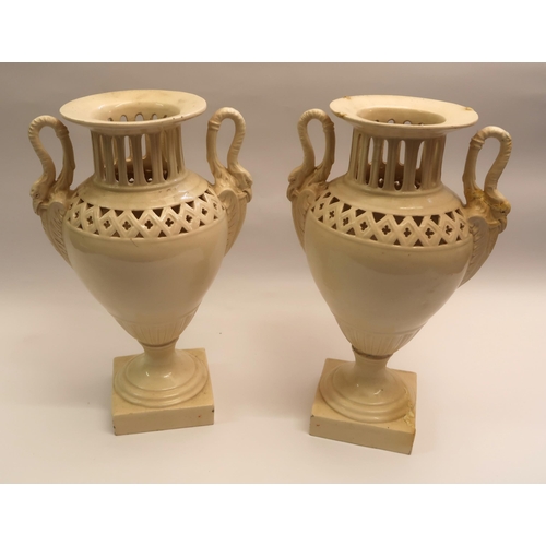 435 - Bretby two handled jardiniere, 31cms tall, together with a pair of creamware style two handled vases... 