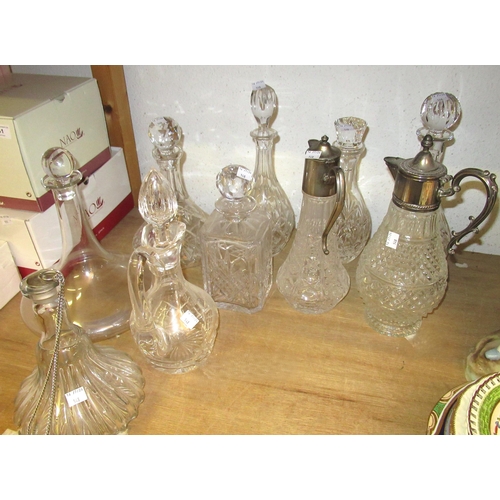 548 - Boxed Waterford crystal paperweight, a group of ten cut glass decanters and claret jugs and two gobl... 