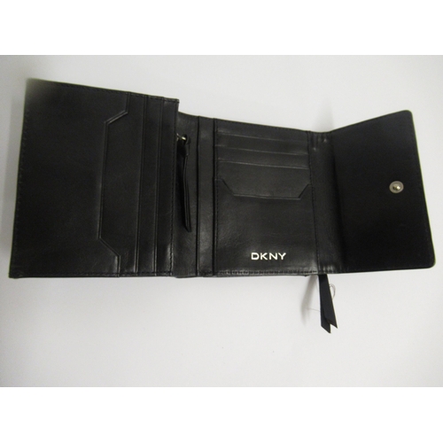 56 - Cartier receipt case in suede pouch, together with a DKNY ladies wallet